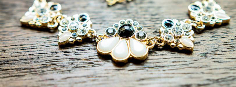 Photo of a necklace with multiple pendants on it